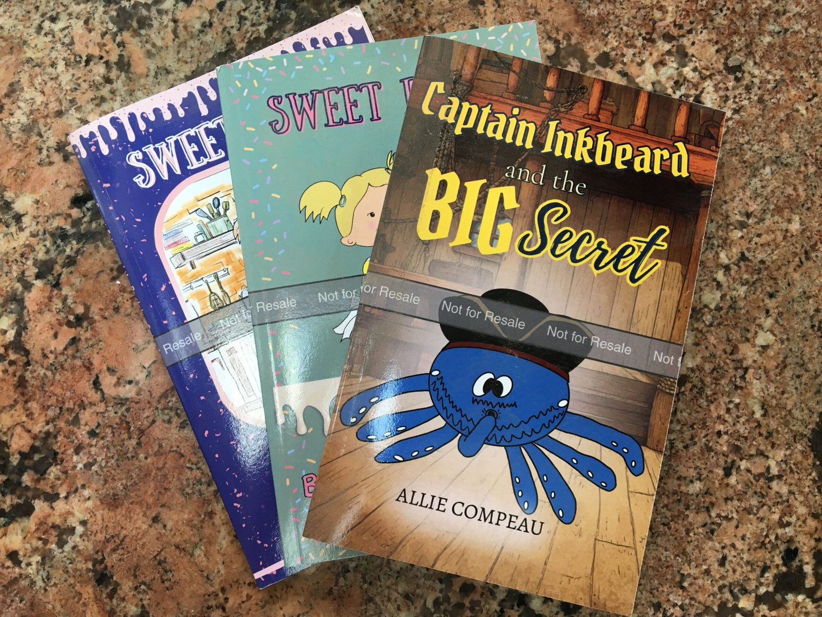 Stack of KDP proof copies for children's books before publication review