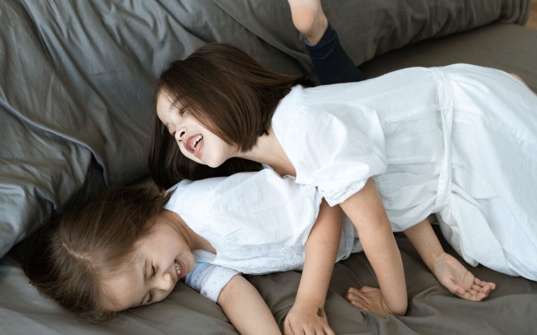 girls lying on the bed